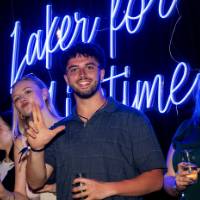 Grads smile on stage during Toast